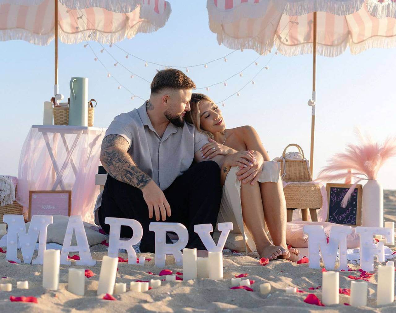 Beach picnic marriage proposal