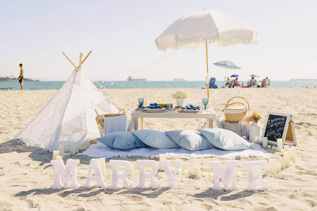 beachside proposal picnic setup
