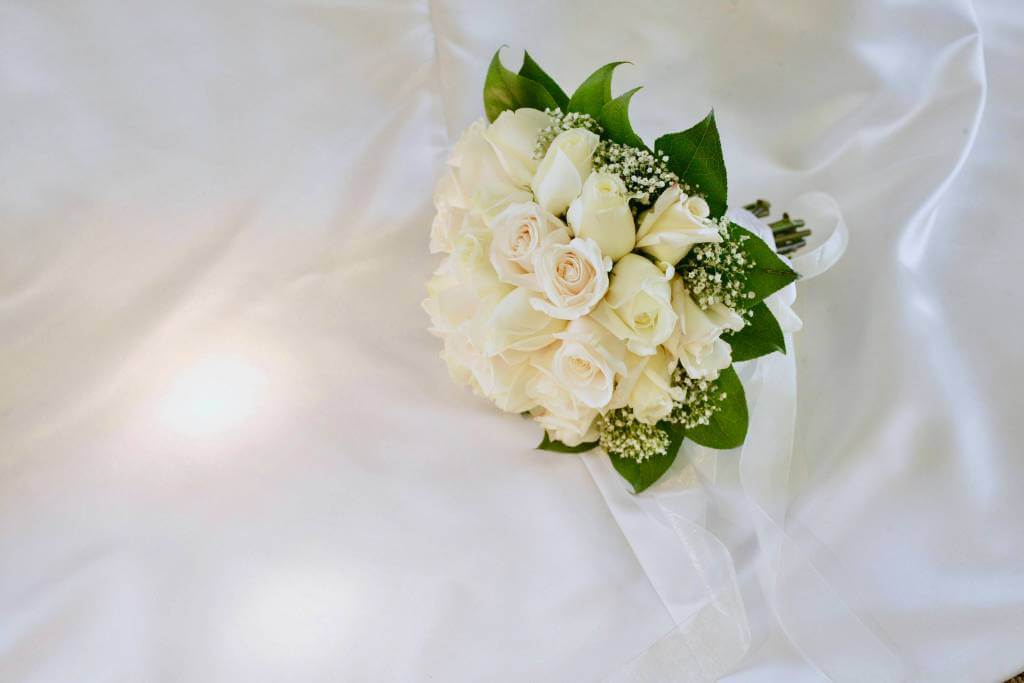 simple ivory bouquet on satin fabric