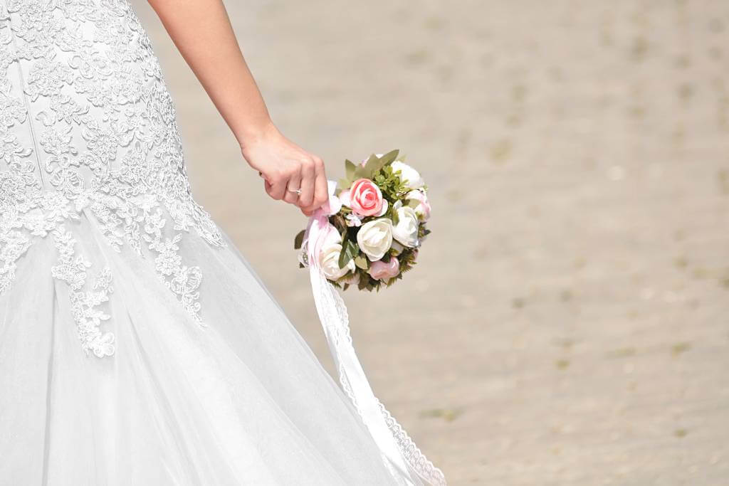 small round bridal bouquet on beach bride