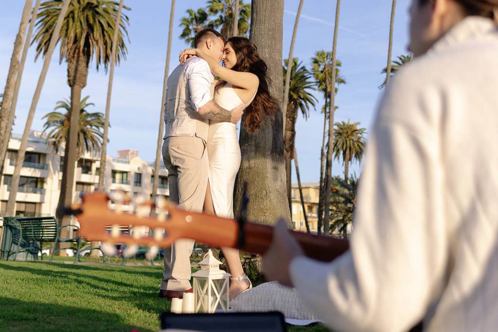backyard proposal with guitarist