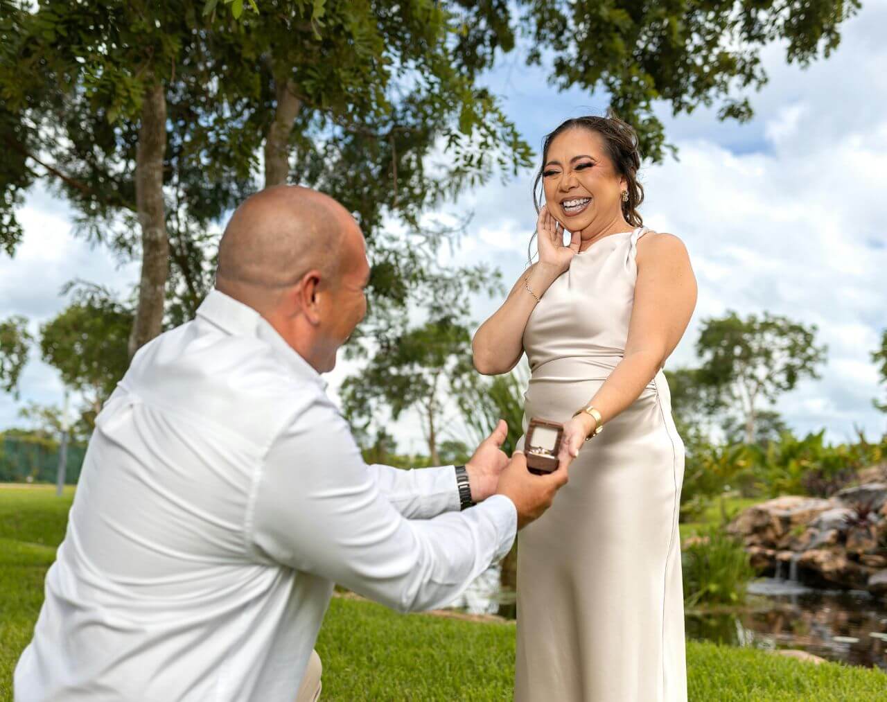man proposing in backyard