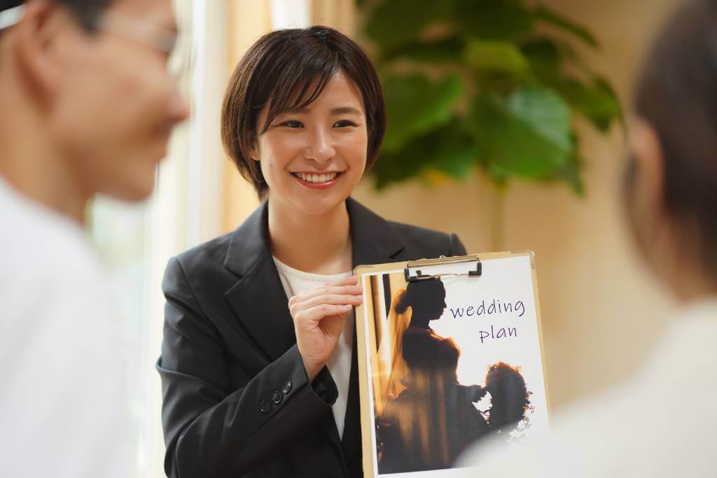 wedding planner holding book