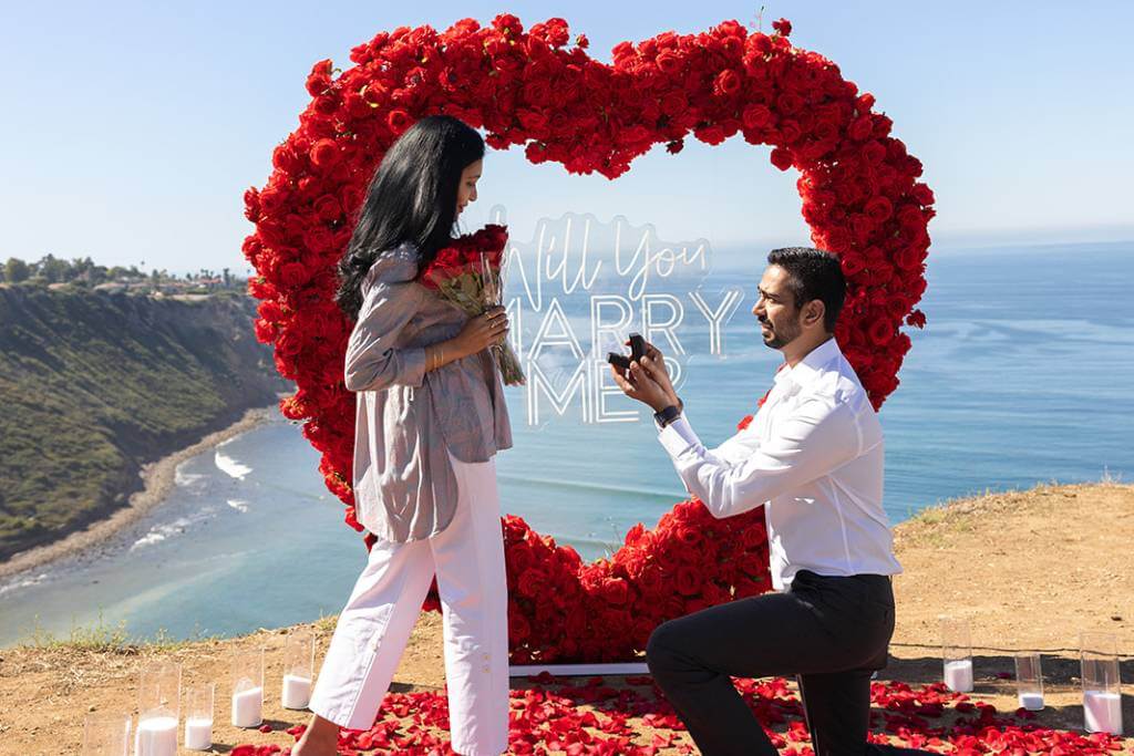 private cliffside proposal rose heart arch