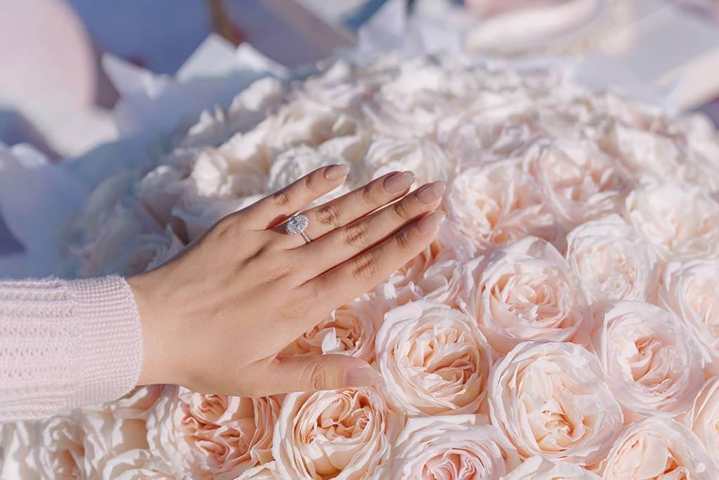 engagement ring on rose petals