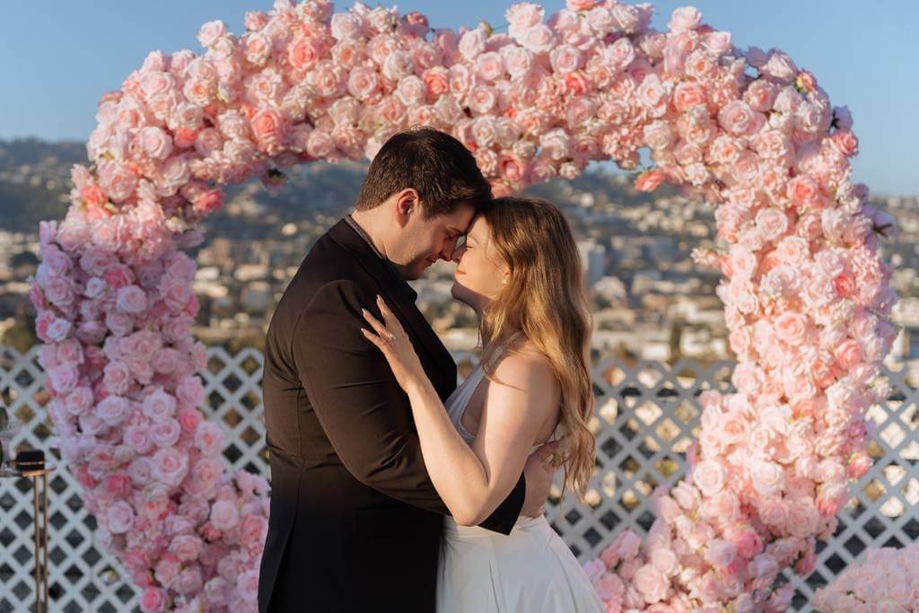 private rooftop proposal floral heart arch